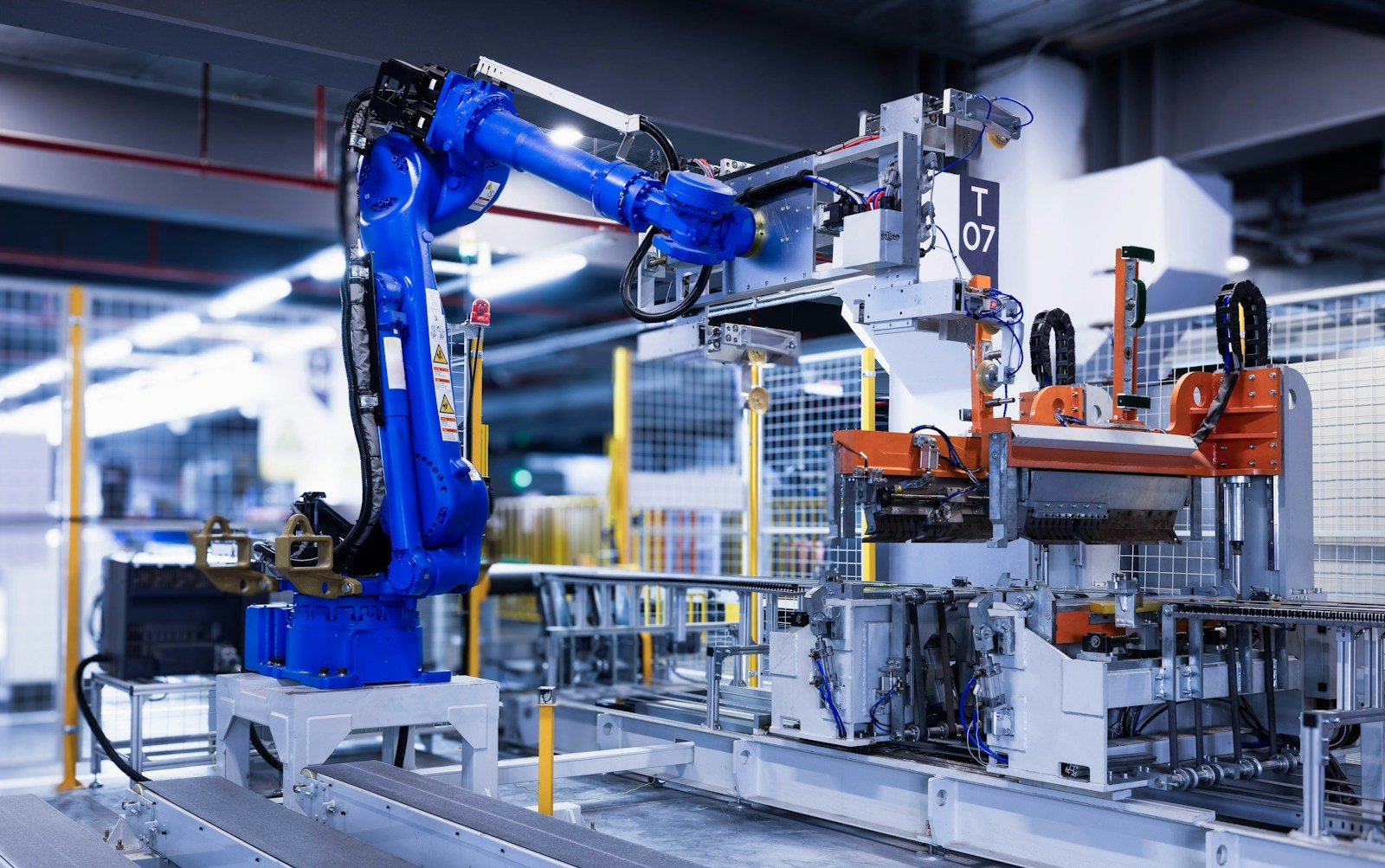 Industrial robot handling a component inside a production line